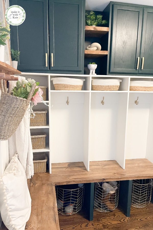 This DIY mudroom has a beautiful corner bench, lockers, cabinets, and a peg rail batten wall. See all of the tutorials and FAQs. #diymudroom #mudroombuild #mudroomstyling #homedecor