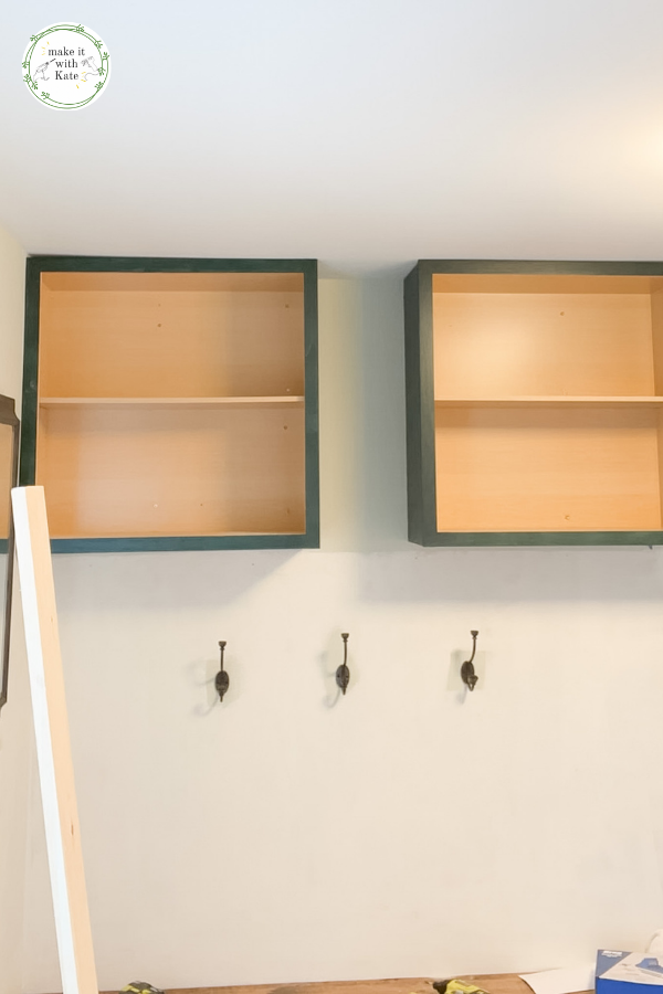 These mudroom locker cabinets use stock wall cabinets as a top for the built in lockers. They make a great finish for a DIY mudroom. #diymudroom #mudroomcabinets #stockcabinets #builtincabinets #stockcabinetbuilds