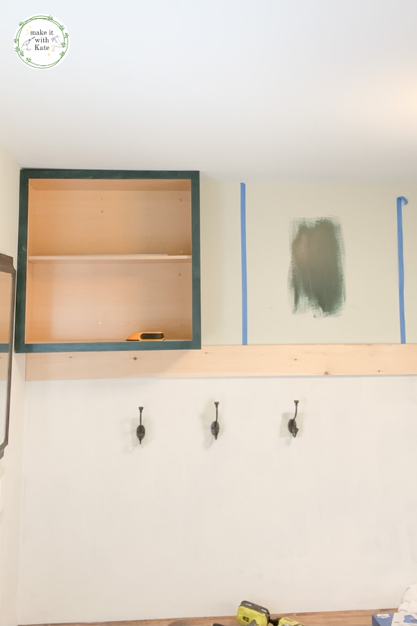 These mudroom locker cabinets use stock wall cabinets as a top for the built in lockers. They make a great finish for a DIY mudroom. #diymudroom #mudroomcabinets #stockcabinets #builtincabinets #stockcabinetbuilds