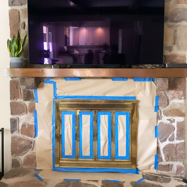 This quick and easy DIY tutorial will show you how to paint a brass fireplace. This will update your home immediately! #paintedfireplace #diyhomeprojects #DIYpaintprojects