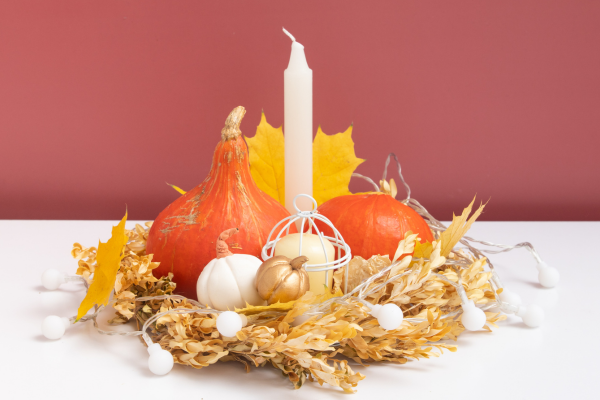 candle with a fall wreath